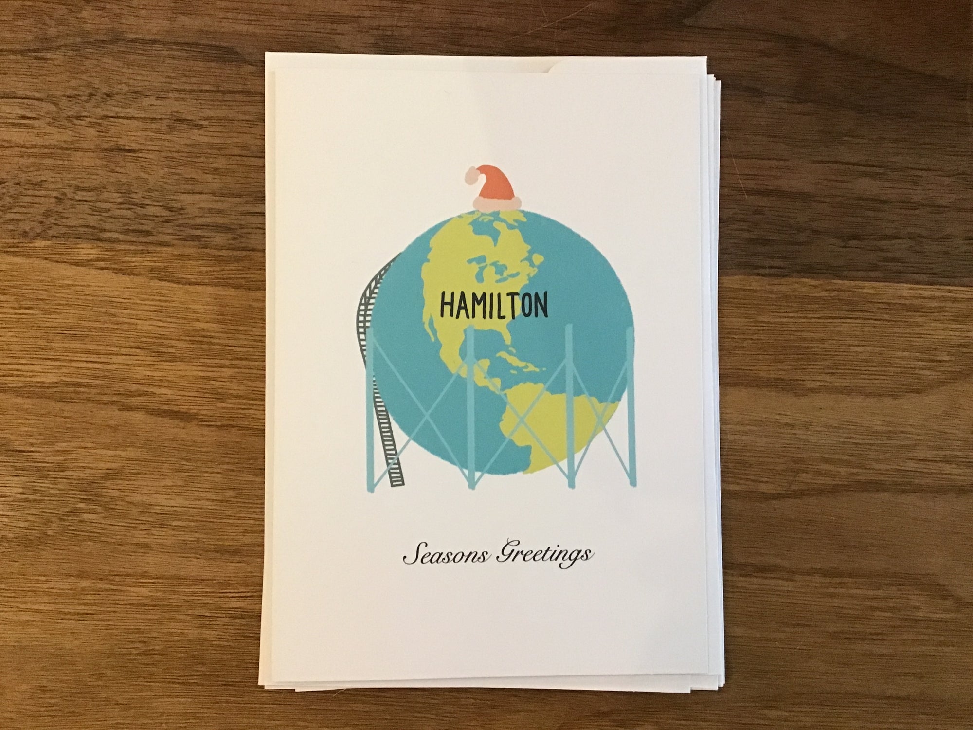 Hamilton Globe Santa Hat Seasons Greetings Card