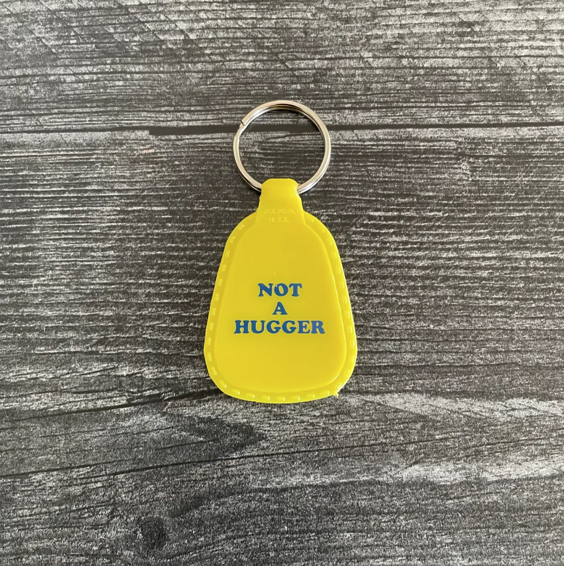 Not A Hugger Saddle Keychain